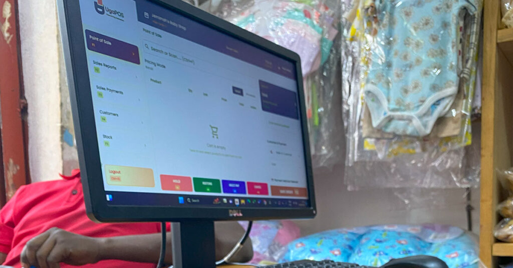 Customer being served quickly at Jemimah Baby Shop using UgaPOS retail POS system